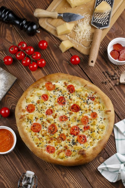 Tomato pizza with ingredients