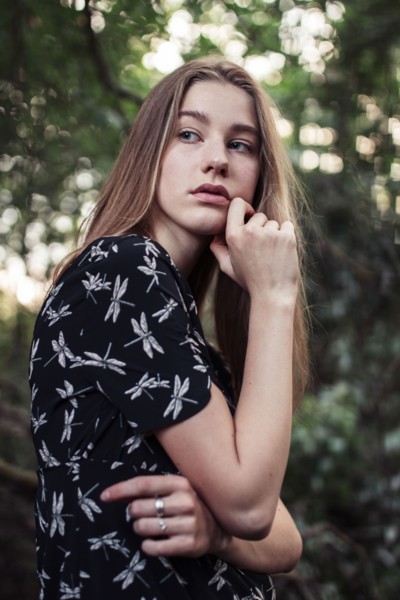 Young woman looking over shoulder