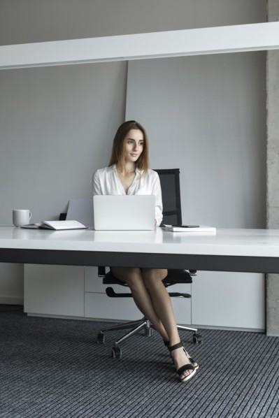 Young businesswoman sitting at desk