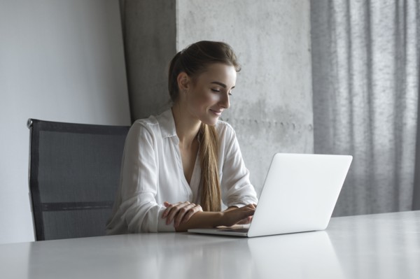 Young businesswoman working on laptop