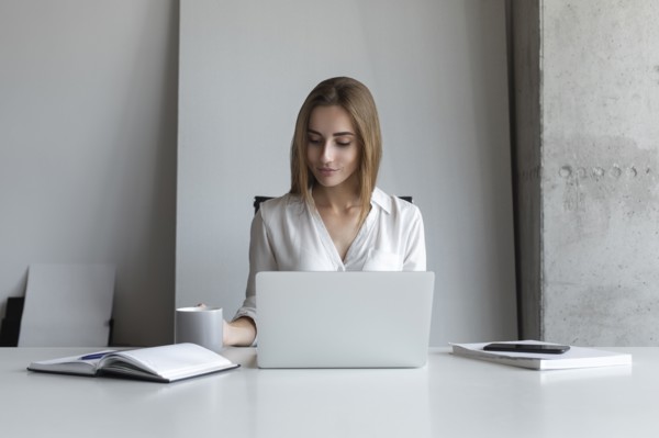 Young businesswoman working at desk
