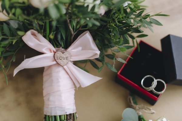 Wedding bouquet tied with pink ribbon