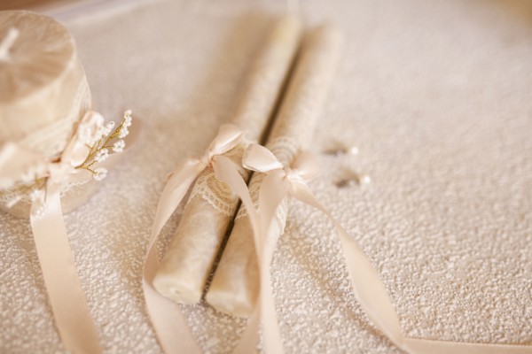 Candles tied by ribbon during wedding
