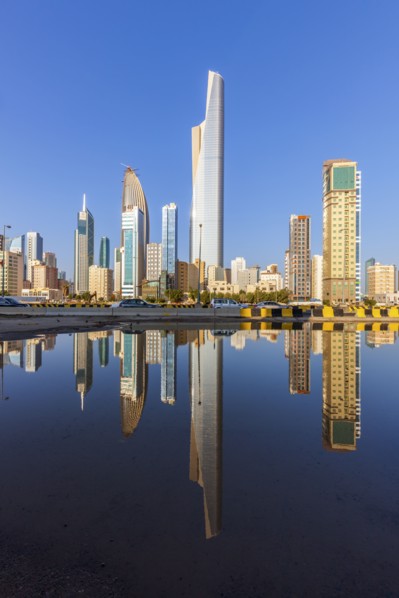 Skyline reflected in sea in Kuwait City, Kuwait
