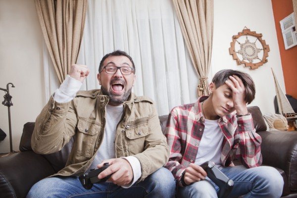 Father and son playing video game