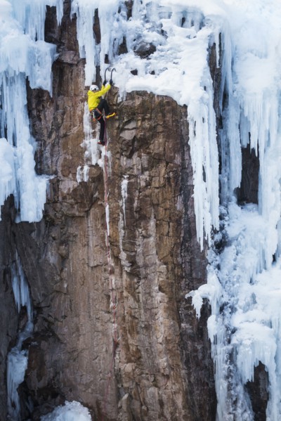 Man ice climbing in Ouray, USA
