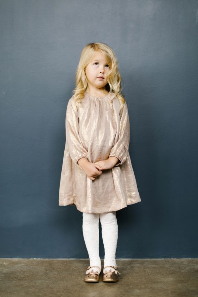 Girl wearing taupe dress