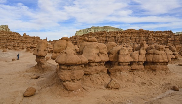 Woman hiking through Goblin Valley State Park in Utah, USA