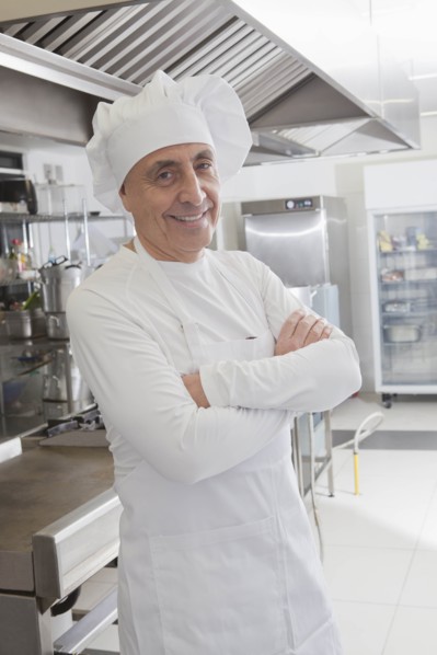 Chef smiling in commercial kitchen