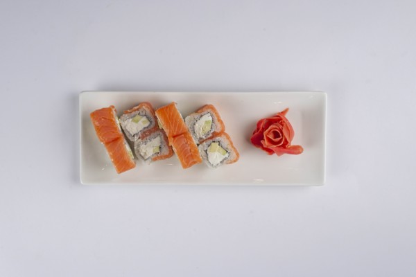 Plate of salmon sushi with pickled ginger