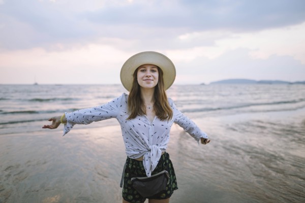 Young woman in sun hat on beach in Krabi, Thailand