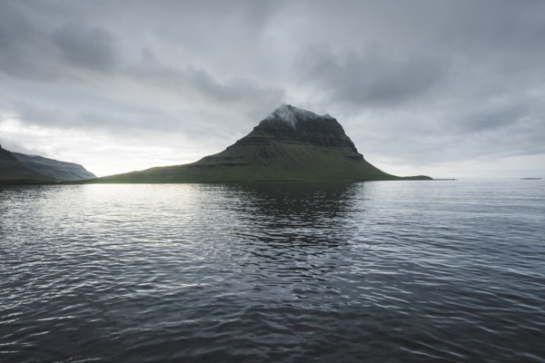 Kirkjufell under overcast sky in Iceland