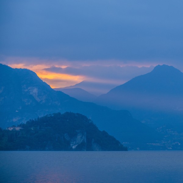 Sunset sky over mountains by Lake Como, Italy