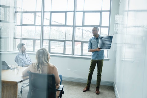 Man using diagram during board room presentation
