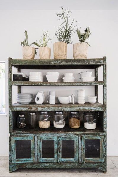 Worn shelves holding tableware