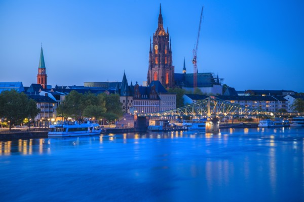 Cathedral by river at sunset in Frankfurt