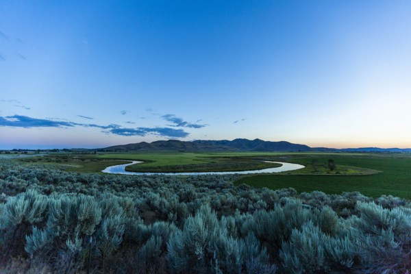 River in field at sunset in Picabo