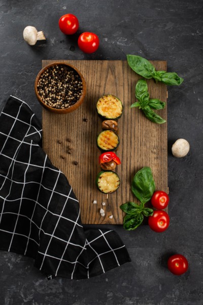 Grilled mushroom and courgette skewer on cutting board