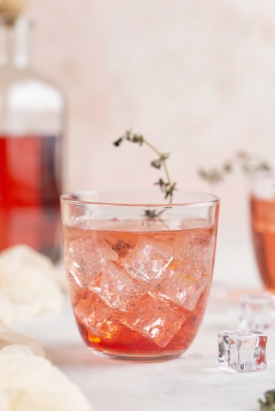 Pink cocktail with ice cubes