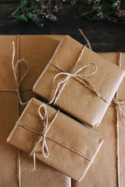 Presents wrapped in brown paper and string