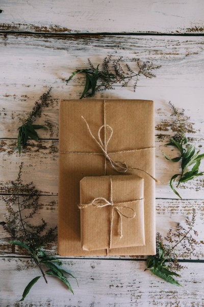 Presents wrapped in brown paper and string with flowers