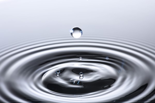 Water drop creating circular ripples