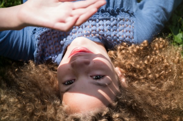 Girl shielding her eyes