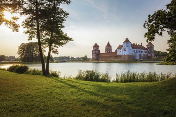 Lake by Mir Castle at sunset in Mir, Belarus