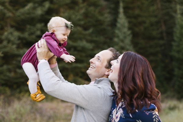 Parents and daughter by forest