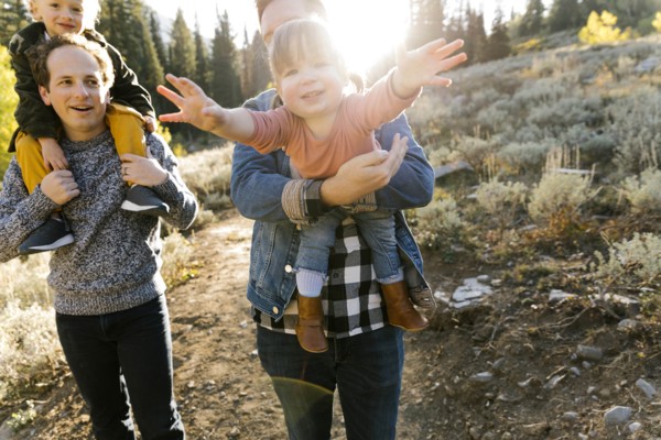Two fathers and daughters while hiking