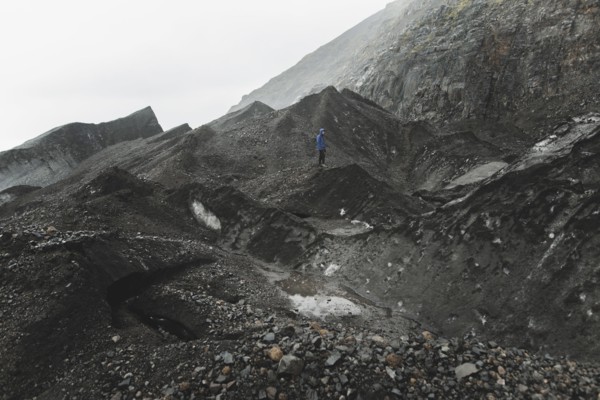 Man walking on rock in Skaftafell, Iceland