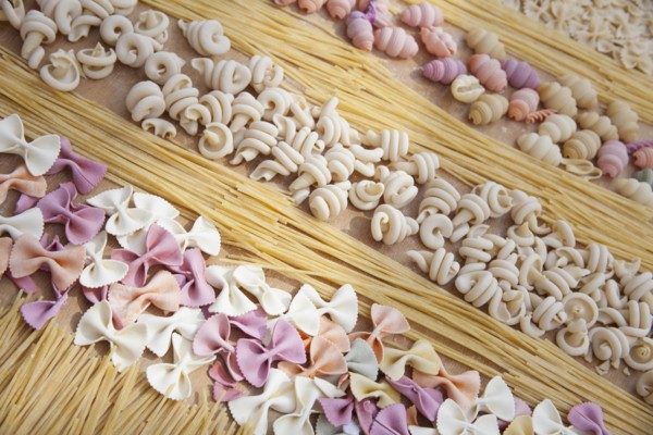 Assorted uncooked pasta in rows