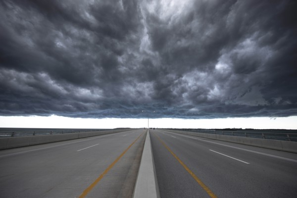 Road under stormy sky