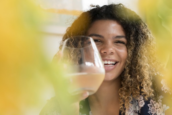 Smiling woman holding drink
