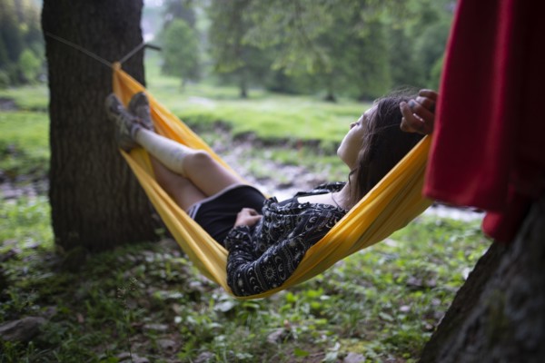 Woman lying in hammock in Appenzell, Switzerland