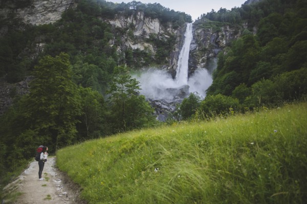 Woman on path to waterfall