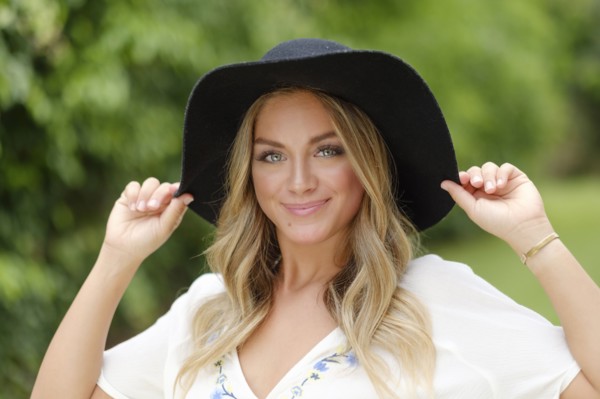 Portrait of young woman in floppy hat