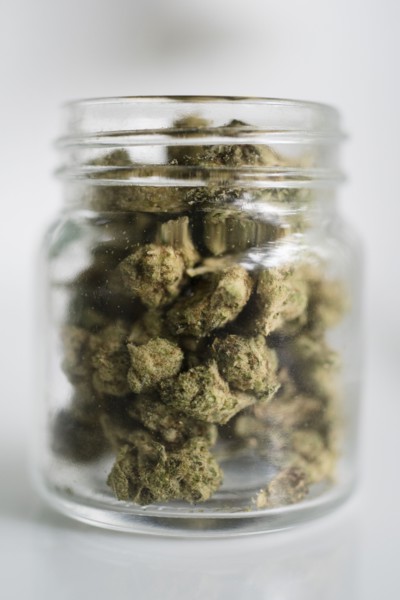 Glass jar filled with marijuana