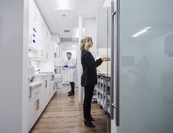Dentist and assistant in sterilization room