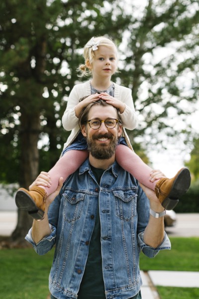 Father giving daughter piggyback ride