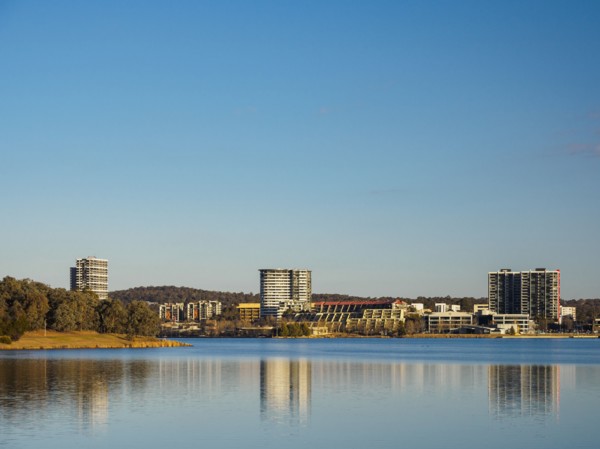 Buildings by lake in Ginninderra, Australia