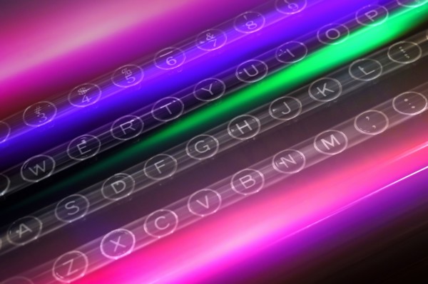 Colorful light trails over keys of typewriter