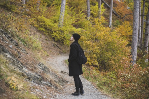 young woman in autumn forest