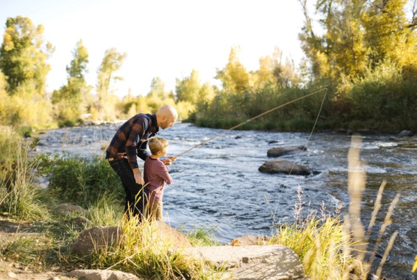 Father and son fishing together