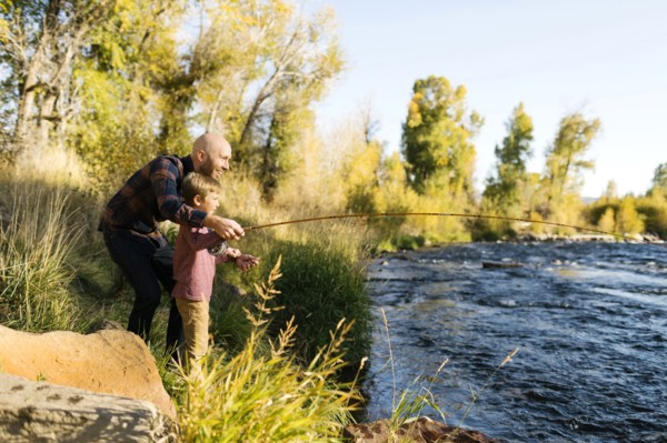 Father and son fishing together