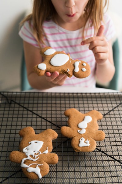 Girl eating gingerbread man