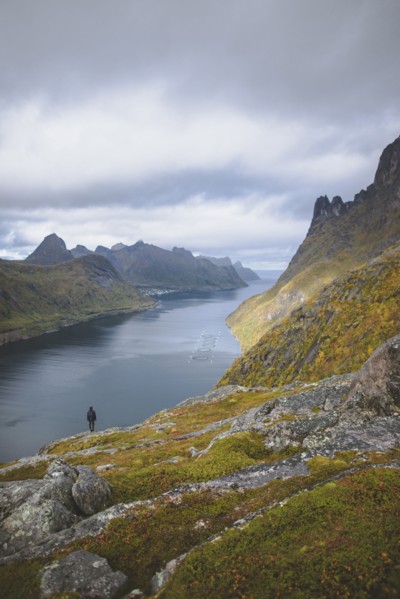 young man hiking on mountain in Norway