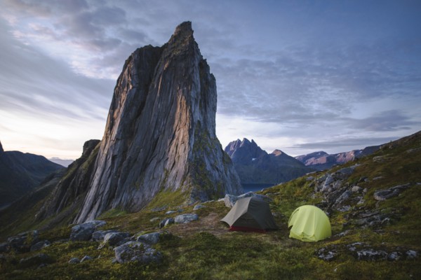 Norway, Senja, Two tents near Segla mountain at sunset