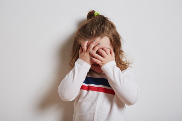 Girl covering her eyes
