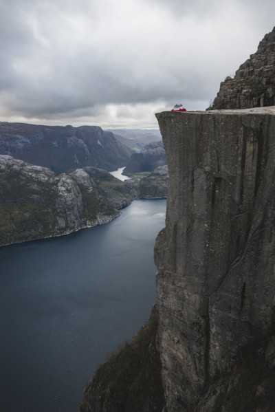 Tent in distance on Preikestolen cliff in Rogaland, Norway